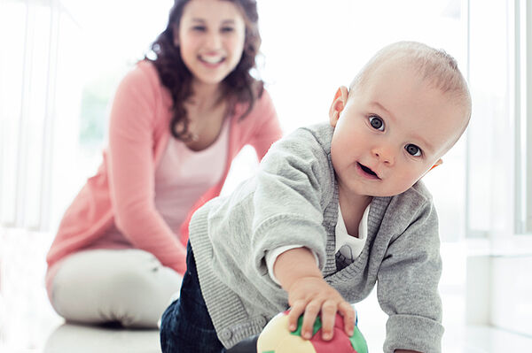 Baby playing with a ball