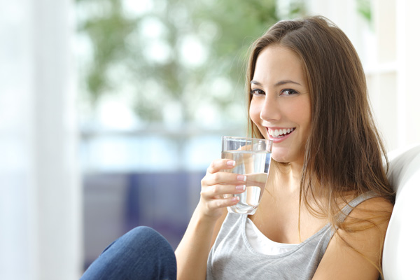 Woman drinking a glass of water