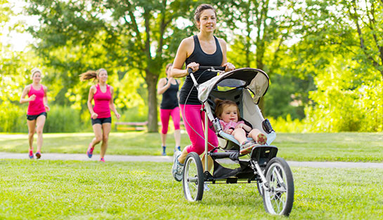 Woman jogging with a stroller